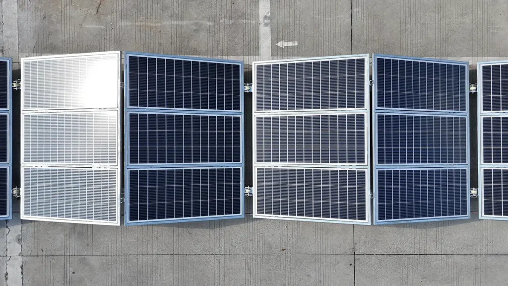 Foldable Photovoltaic Container Deployment System Foldable photovoltaic panels deployed from a container on aluminum support rails at an industrial site